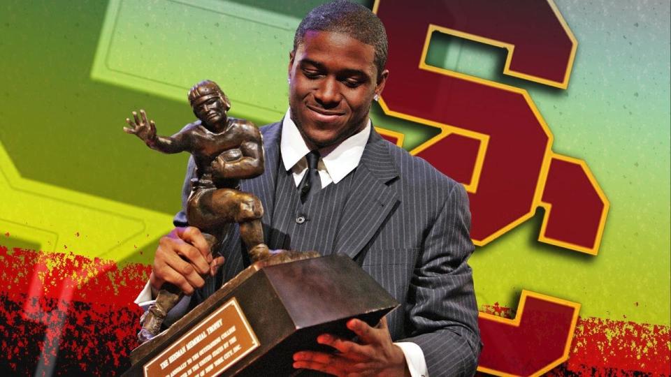 Reggie Bush, as University of Southern California tailback, posing with his 2005 Heisman Trophy, New York, partial graphic