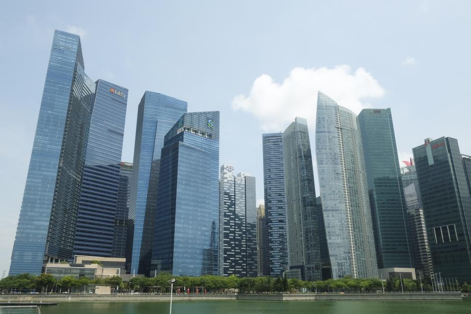 SINGAPORE - JULY 21: A view of the DBS Bank headquarters (2nd L) and Standard Chartered corporate office at Marina Bay Financial Centre, Singapore on July 21, 2019. (Photo by Adli Ghazali/Anadolu Agency via Getty Images)