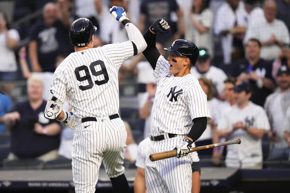 New York Yankees' Anthony Rizzo, right, celebrates with Aaron Judge after Judge hit a home run against the Minnesota Twins during the first inning of a baseball game Friday, April 14, 2023, in New York. (AP Photo/Frank Franklin II)