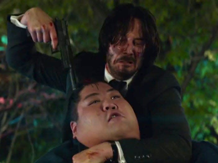 Keanu Reeves as John Wick fighting Yama as the sumo assassin.
