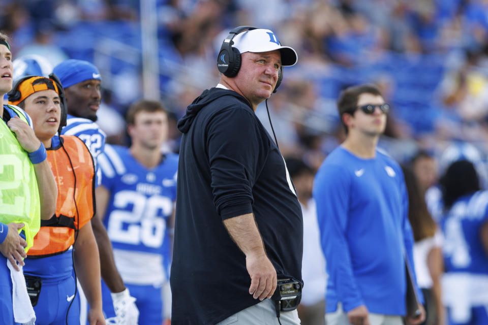 Duke head coach Mike Elko, center, looks toward the scoreboard during the first half of an NCAA college football game against Northwestern in Durham, N.C., Saturday, Sept. 16, 2023. (AP Photo/Ben McKeown)