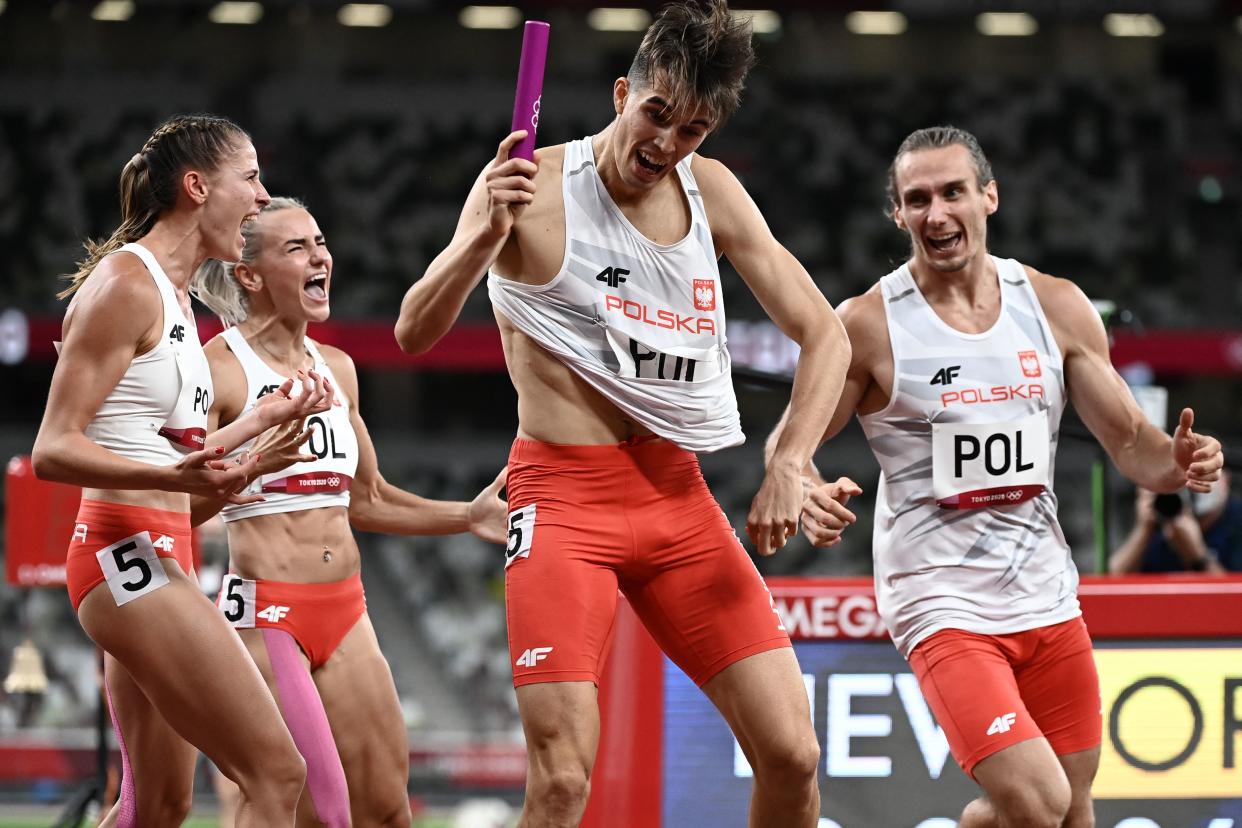 Poland's celebrate winning the mixed 4x400m relay final during the Tokyo 2020 Olympic Games at the Olympic Stadium in Tokyo on July 31, 2021. (Photo by Jewel SAMAD / AFP) (Photo by JEWEL SAMAD/AFP via Getty Images)