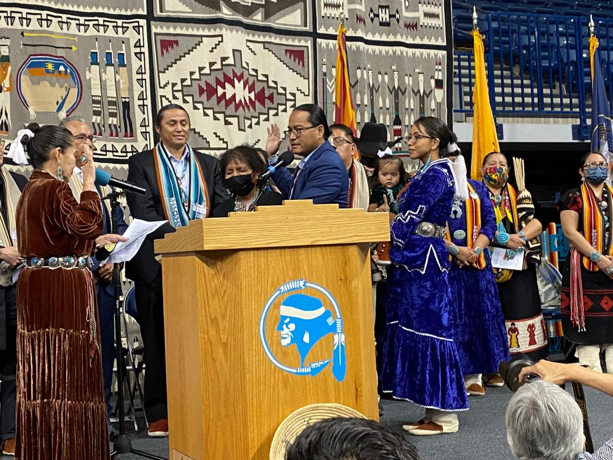 Navajo Nation President Buu Van Nygren takes the oath of office Tuesday as his wife, former State Rep. Jasmine Blackwater-Nygren, and their daughter look on.