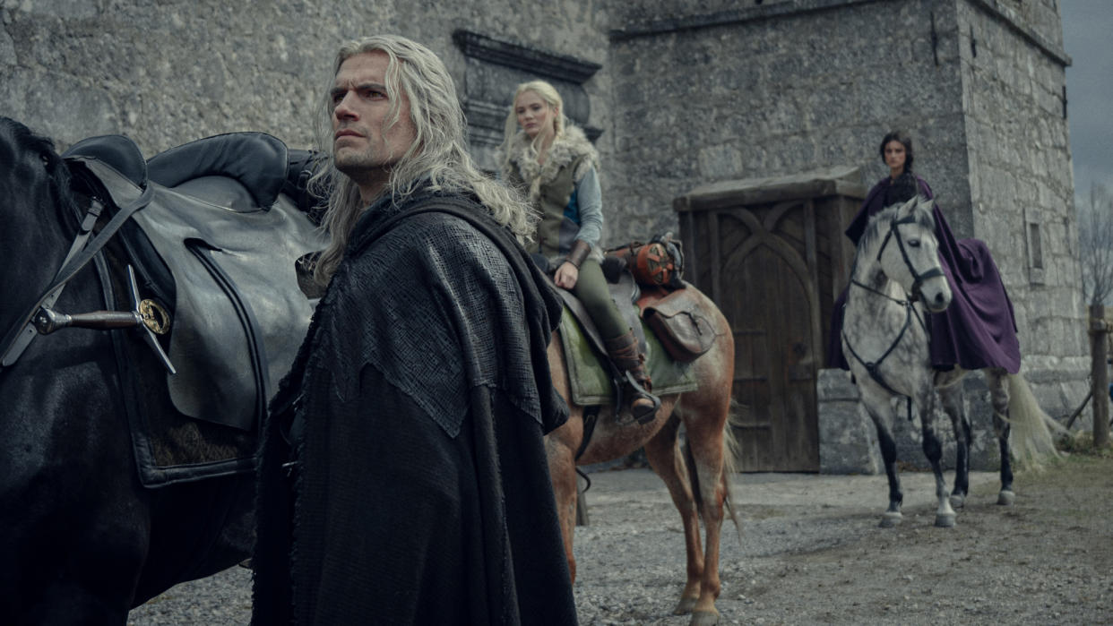  Geralt, Ciri, and Yennefer prepare to ride off on horses in The Witcher season 3 