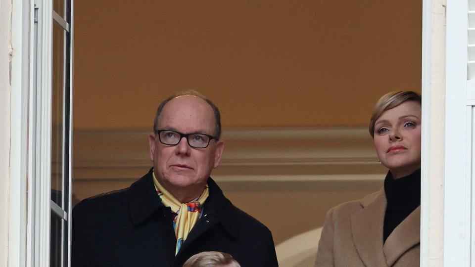 Prince Albert, Princess Charlene and their kids watch as floats, performers, a live band and elephants walk in the Circus Parade