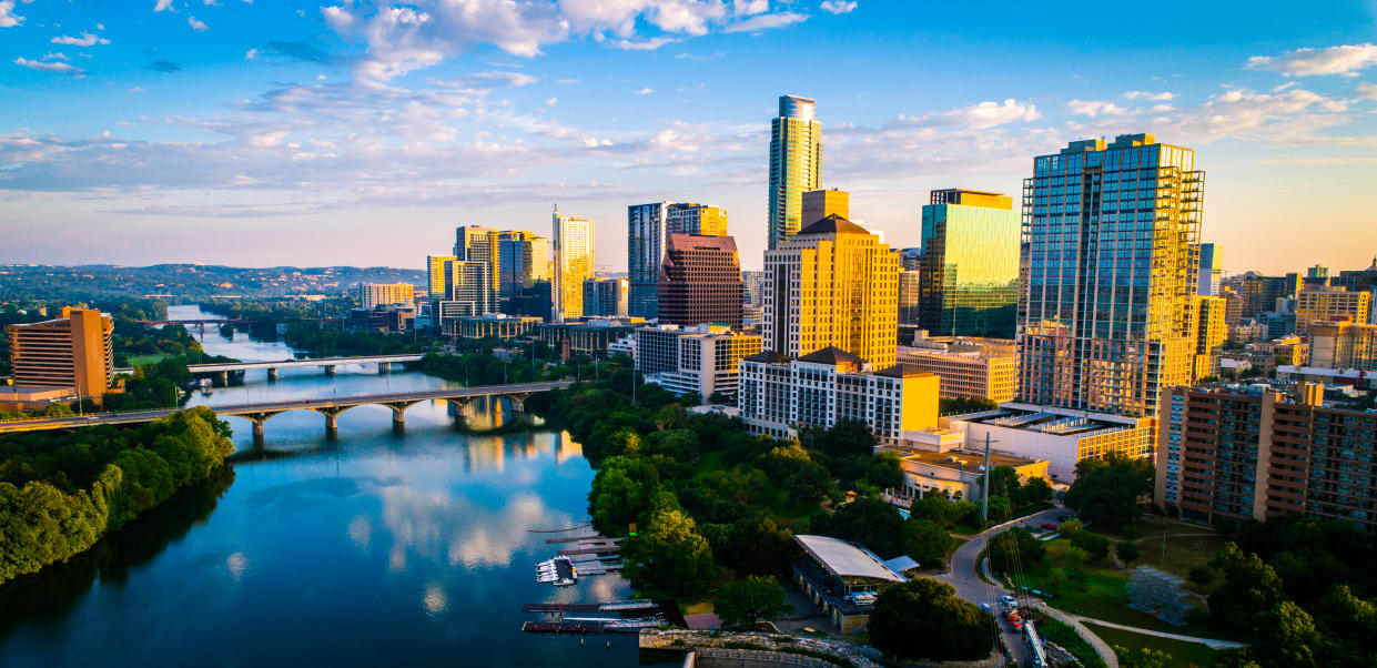 Austin Texas aerial drone of capital city of Texas - Austin texas panoramic panorama aerial drone sunrise golden colors across colorful skyline cityscape