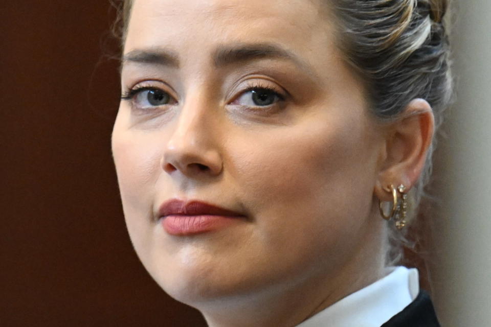 Actress Amber Heard listens in the courtroom at the Fairfax County Circuit Court in Fairfax, Va., Tuesday May 3, 2022. Actor Johnny Depp sued his ex-wife Amber Heard for libel in Fairfax County Circuit Court after she wrote an op-ed piece in The Washington Post in 2018 referring to herself as a "public figure representing domestic abuse." (Jim Watson/Pool photo via AP)