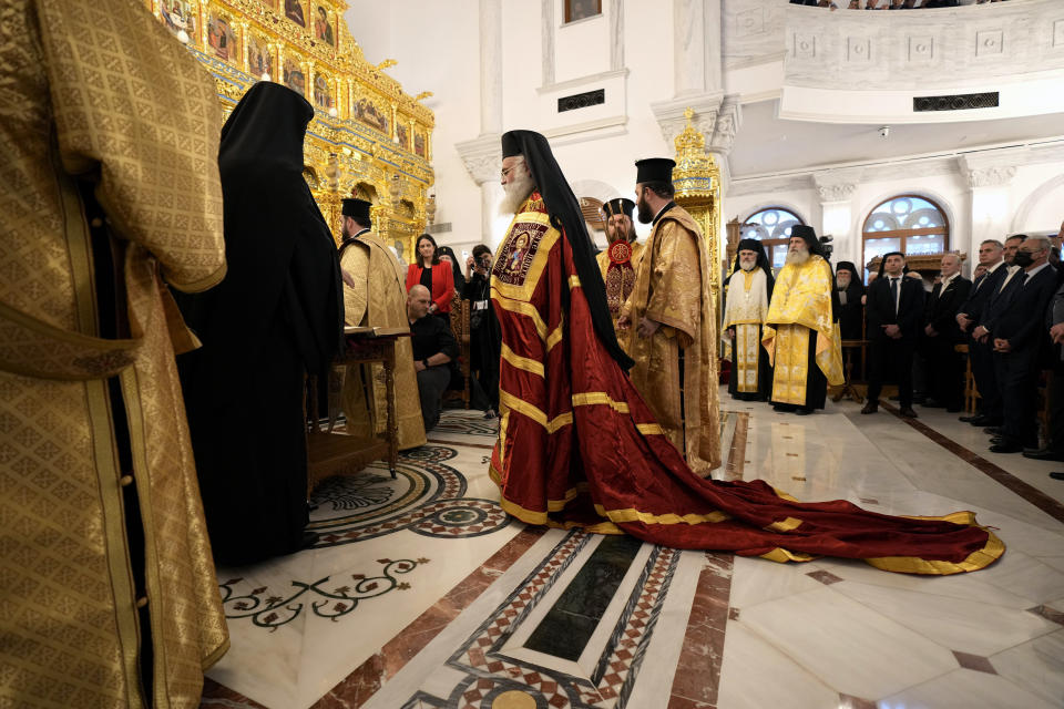 The head of Cyprus' Orthodox Church Archbishop Georgios stands in front of the chancel during his enthronement ceremony at Saint Barnabas Cathedral in capital Nicosia, Cyprus, Sunday, Jan. 8, 2023. Archbishop Georgios formally assumed his new duties following an enthronement ceremony evoking the splendor of centuries of Byzantine tradition before an audience of Orthodox clergy from around the world with the notable exception of the Russian church. The Cyprus Church has recognized the independence of the Orthodox Church of Ukraine. (AP Photo/Petros Karadjias)