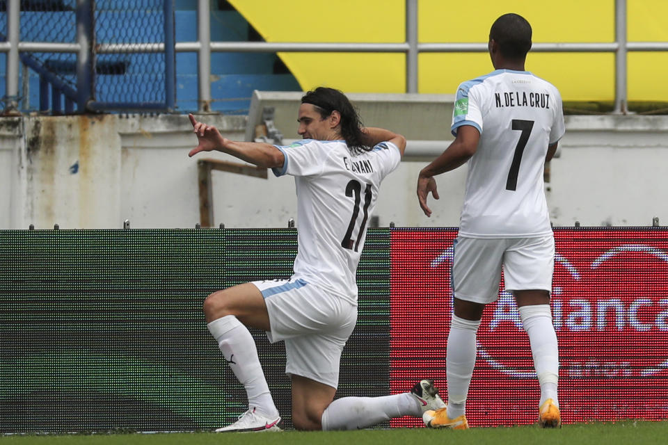 Uruguay's Edinson Cavani celebrates scoring opening goal during a qualifying soccer match for the FIFA World Cup Qatar 2022 against Colombia at the Metropolitano stadium in Barranquilla, Colombia, Friday, Nov. 13, 2020. (AP Photo/Fernando Vergara)