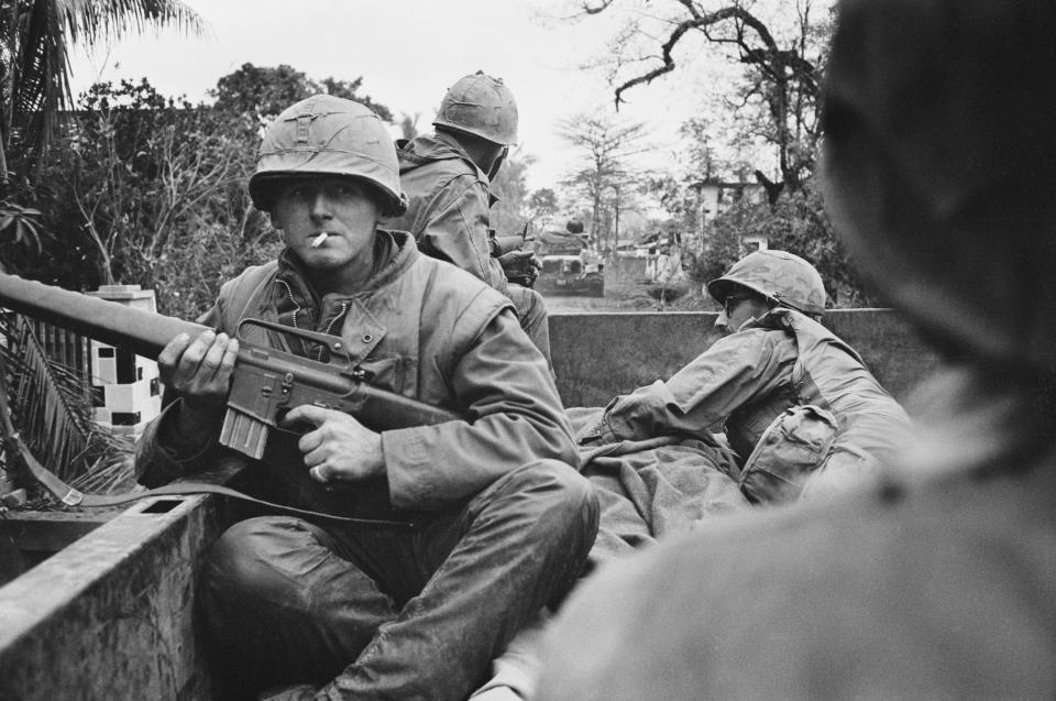 <p>American troops on board a truck at a forward command post in the city of Huế, during the Battle of Huế, Vietnam War, February 1968. (Photo: Terry Fincher/Daily Express/Hulton Archive/Getty Images) </p>