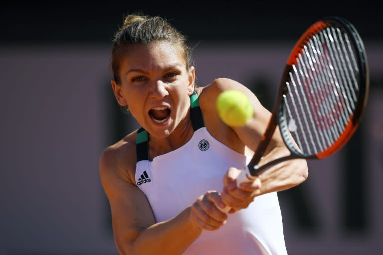 Romania's Simona Halep returns the ball to Latvia's Jelena Ostapenko during their final tennis match at the Roland Garros 2017 French Open on June 10, 2017 in Paris