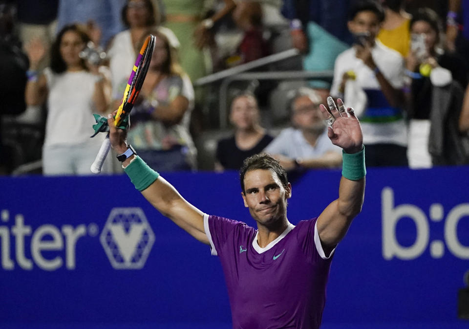 Rafael Nadal of Spain salutes cheering fans after defeating Denis Kudla of the U.S. at the Mexican Open tennis tournament in Acapulco, Mexico, Tuesday, Feb. 22, 2022. (AP Photo/Eduardo Verdugo)