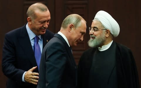 Mr Erdogan hosted Mr Putin and Mr Rouhani in Ankara - Credit: ADEM ALTAN/AFP/Getty Images