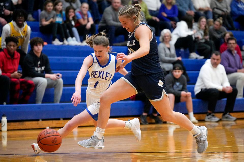 Bexley's Mikayla Williams (1) and Granville's Ella Hoover (20) race to recover the ball during the first quarter of the game between Granville and host Bexley on Tuesday night.