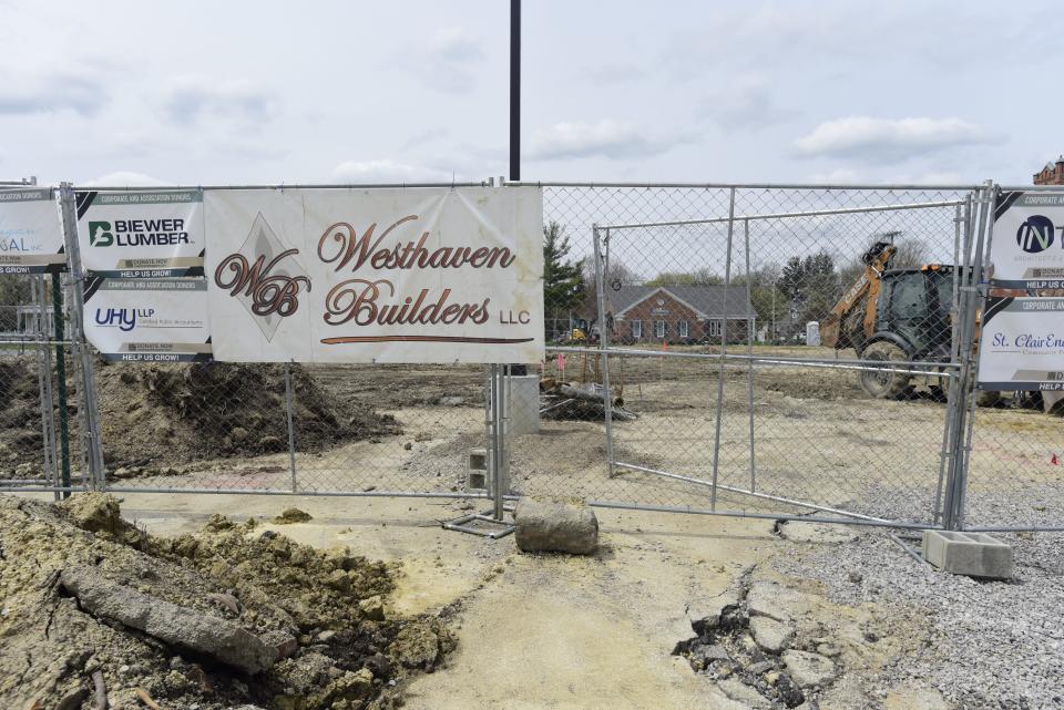 Westhaven Builders LLC banner hangs on a closed fence at the construction site for a new theater on the south end of the plaza parking lot in St. Clair on Thursday, May 5, 2022.