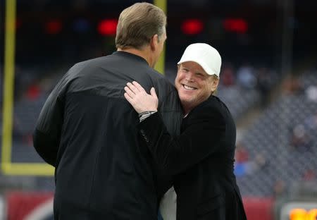 FILE PHOTO: Oakland Raiders owner Mark Davis smiles as he hugs coach Jack Del Rio prior to the game against the Houston Texans in the AFC Wild Card playoff football game at NRG Stadium. Mandatory Credit: Matthew Emmons-USA TODAY Sports