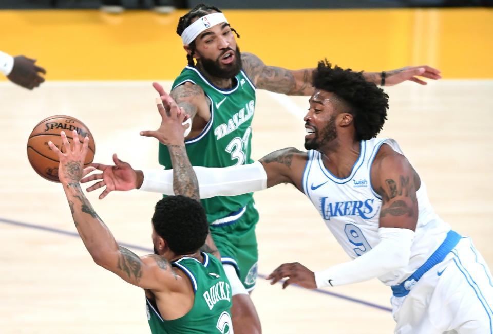 Lakers guard Wesley Matthews battles for a loose ball with Mavericks guard Trey Burke and center Willie Cauley-Stein.