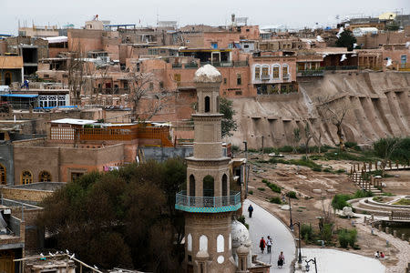 People make their way through the Old City in Kashgar, Xinjiang Uighur Autonomous Region, China September 6, 2018. REUTERS/Thomas Peter