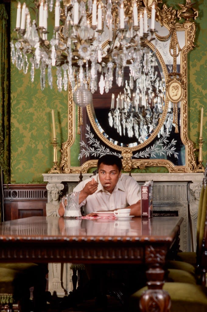 Muhammad Ali in a portrait series eating cereal at his dining room table at his home. Getty Images