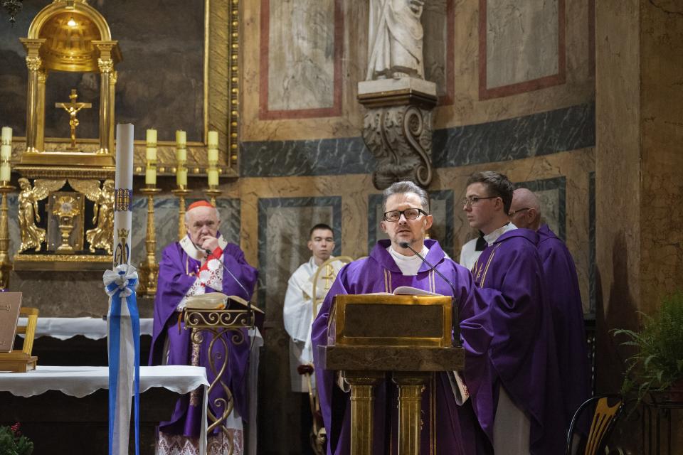 The Rev. Viachaslau Barok, a Catholic priest from Belarus, conducts a service in the Church of St. Alexander in Warsaw, Poland, Saturday, Dec. 10, 2022. Barok was a familiar face in Rasony, a town in northern Belarus near the Russian border, overseeing construction of its Roman Catholic church and celebrating Mass daily for two decades before he fled the country as the Belarusian government cracked down on dissent. (Validated UGC via AP)