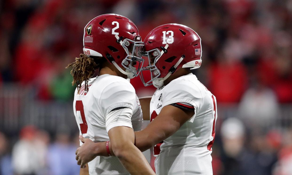 ATLANTA, GA - JANUARY 08: Tua Tagovailoa #13 celebrates a touchdown pass with Jalen Hurts #2 of the Alabama Crimson Tide during the third quarter against the Georgia Bulldogs in the CFP National Championship presented by AT&T at Mercedes-Benz Stadium on January 8, 2018 in Atlanta, Georgia.  (Photo by Streeter Lecka/Getty Images)
