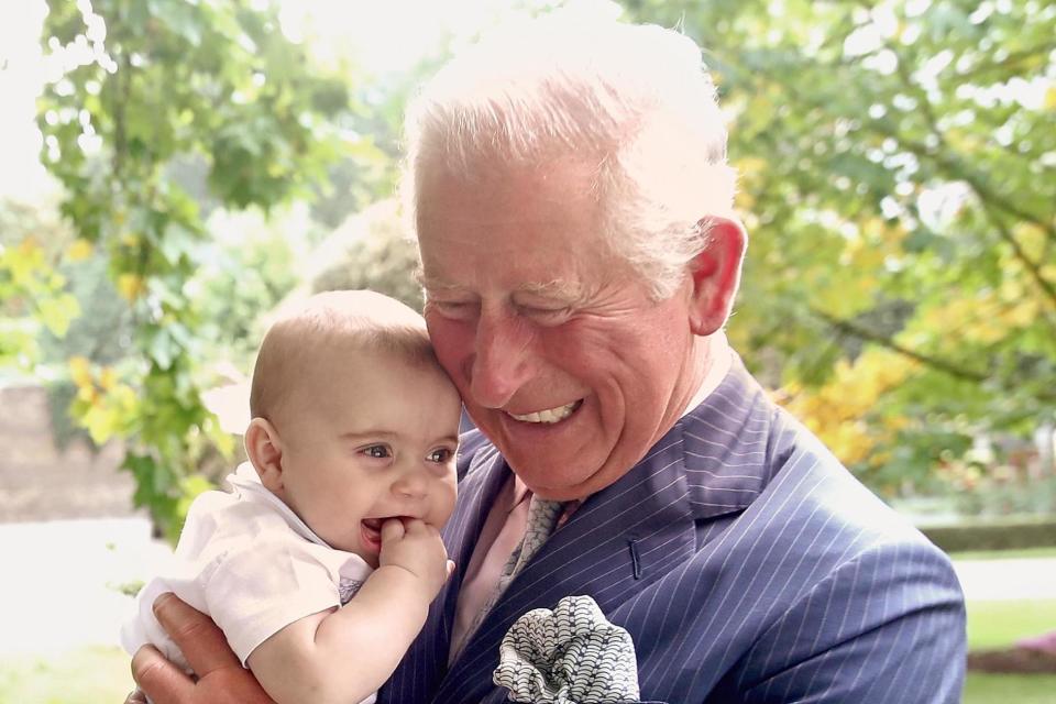 Prince of Wales holds Prince Louis of Cambridge: Getty Images for Clarence House