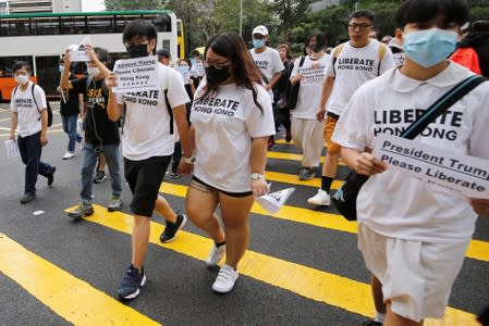 Hong Kong activists march to major international consulates in an attempt to rally foreign governments' support for their fight against a controversial extradition bill, in Hong Kong