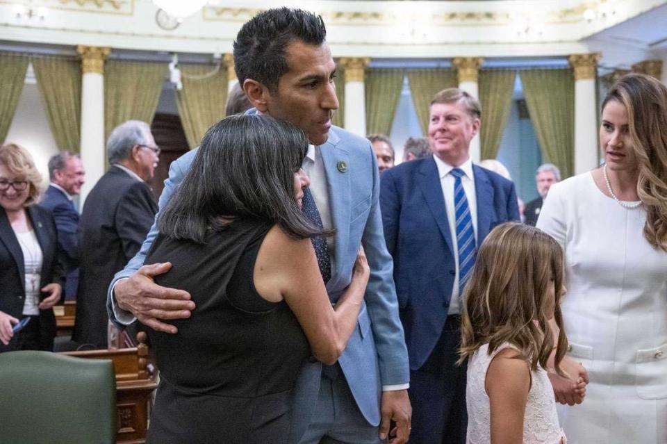 Mayra Flores, the single mother of Assembly Speaker Robert Rivas, D-Salinas, on Friday hugs her son before he took the oath of office at the state Capitol in Sacramento.