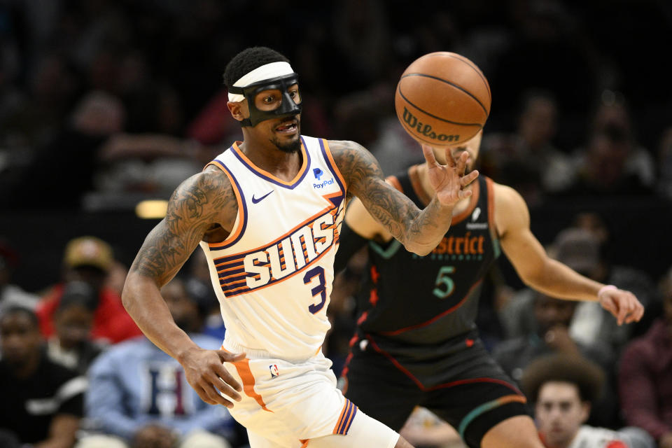 Phoenix Suns guard Bradley Beal (3) chases the ball during the first half of an NBA basketball game against the Washington Wizards, Sunday, Feb. 4, 2024, in Washington. (AP Photo/Nick Wass)