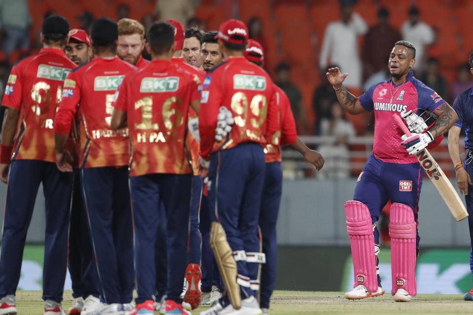 Rajasthan Royals' Shimron Hetmyer, right, celebrates after winning the Indian Premier League cricket match between Punjab Kings and Rajasthan Royals in Mohali, India, Saturday, April 13, 2024. (AP Photo/Surjeet Yadav)