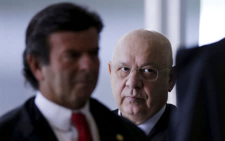 Judge Teori Zavascki (C) and Judge Luiz Fux arrive to attend a session to rule on the validity of impeachment proceedings against President Dilma Rousseff at the Supreme Court justice in Brasilia, Brazil, December 17, 2015. REUTERS/Ueslei Marcelino/File photo