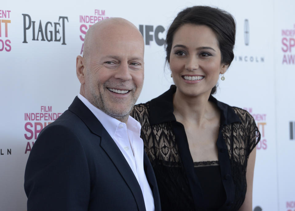 Actor Bruce Willis and his wife Emma Heming arrive at the 2013 Film Independent Spirit Awards in Santa Monica, California February 23, 2013. REUTERS/Phil McCarten (UNITED STATES - Tags: ENTERTAINMENT) 