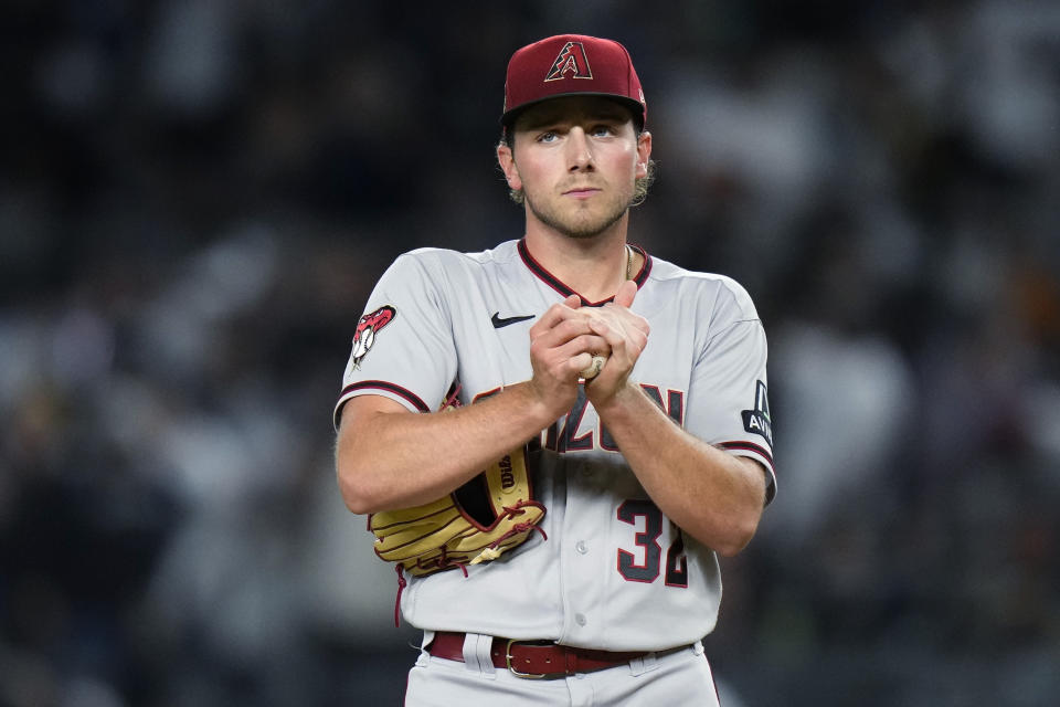 Arizona Diamondbacks starting pitcher Brandon Pfaadt rubs up a new ball after New York Yankees' Aaron Judge hit a three-run home run during the third inning of a baseball game Friday, Sept. 22, 2023, in New York. (AP Photo/Frank Franklin II)