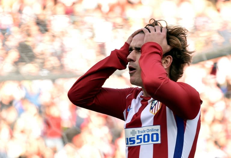 Atletico Madrid's forward Antoine Griezmann reacts after missing a goal against Barcelona at the Vicente Calderon stadium in Madrid on February 26, 2017