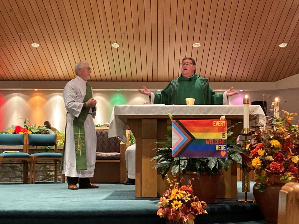 The Rev. Greg Greiten presides over the LGBTQ Mass of Celebration and Inclusion at St. Bernadette Catholic Parish in Milwaukee on Oct. 8, 2022. He was joined by Deacon Sandy Sites, left, parish director of Good Shepherd Catholic Church. Theological visions of "a church that enthusiastically celebrates same-sex loves as incarnations of God's love among us" inspire hope for some Catholics and concern for others.