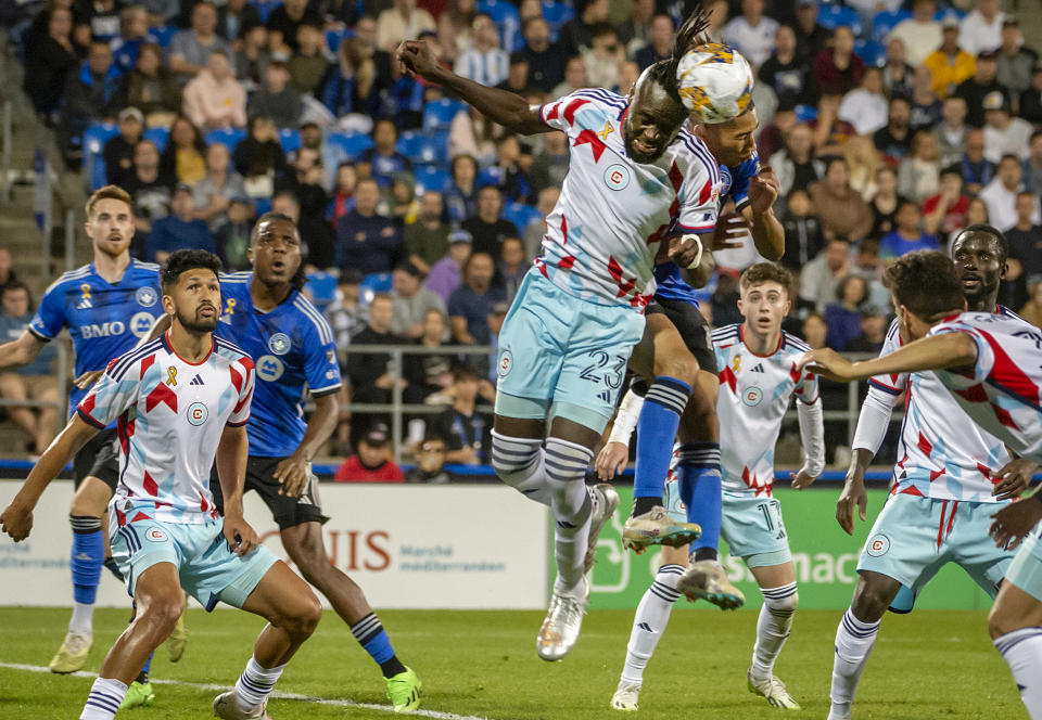 Chicago Fire's Kei Kamara (23) clears the ball with a header during the second half of an MLS soccer match against CF Montreal in Montreal, Saturday, Sept. 16, 2023. (Peter McCabe/The Canadian Press via AP)