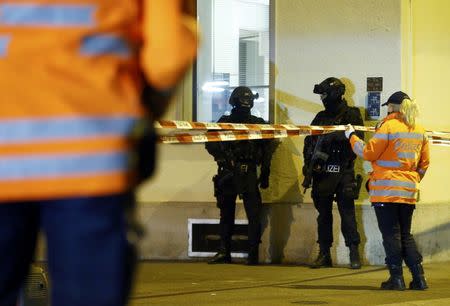 Police stand outside an Islamic center in central Zurich, Switzerland December 19, 2016. REUTERS/Arnd Wiegmann