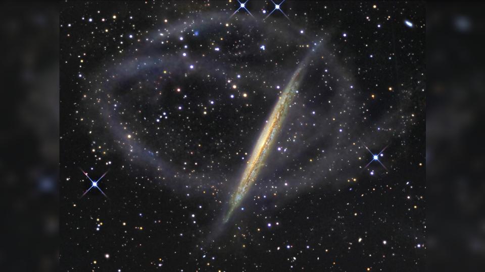 Like the Milky Way, galaxy NGC 5907 has narrow streams of stars that orbit it.