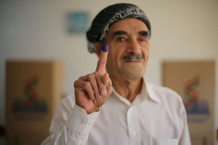 A man shows his ink-stained finger during Kurds independence referendum in Erbil, Iraq September 25, 2017. REUTERS/Ahmed Jadallah