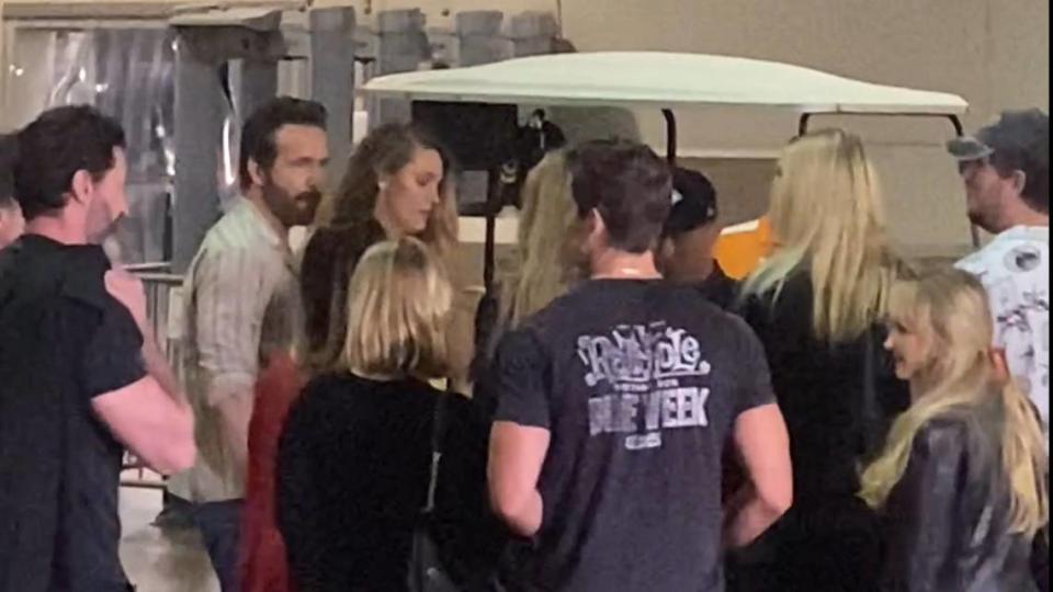 Ryan Reynolds, second from left, and Blake Lively are seen in a group of people with Taylor Swift arriving at the New York Jets-Kansas City Chiefs game on Oct. 1, 2023.
