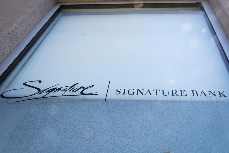 FILE PHOTO: The company logo for Signature Bank is displayed at a location in Brooklyn, New York