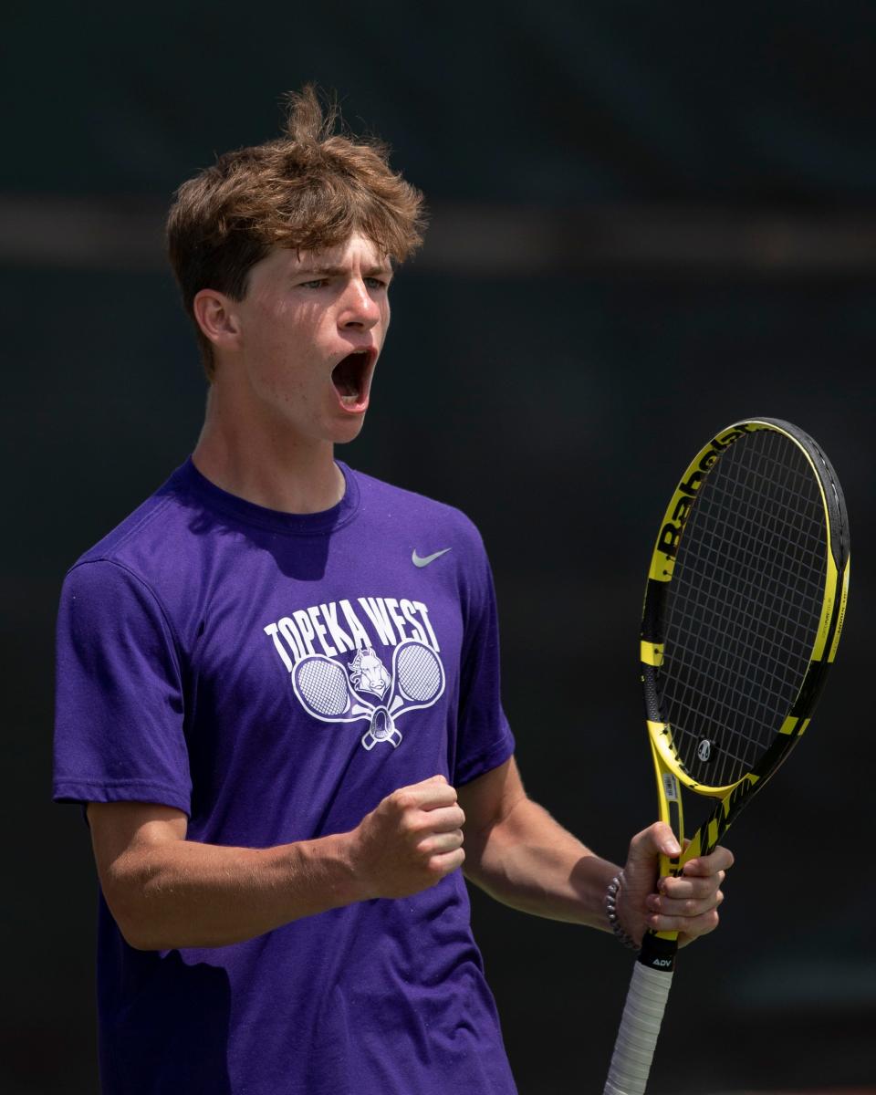 Topeka West Ian Cusick reacts after wininng the championship doubles match Saturday at Kossover Tennis Court.