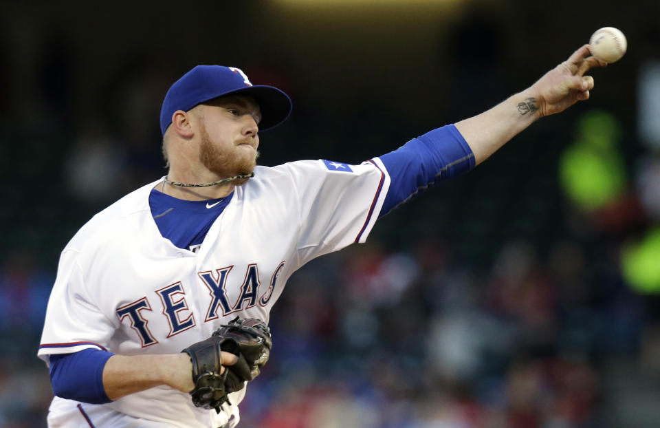 Texas Rangers starting pitcher Robbie Ross Jr. throws during the first inning of the MLB American baseball game against the Seattle Mariners Tuesday, April 15, 2014, in Arlington, Texas. (AP Photo/LM Otero)