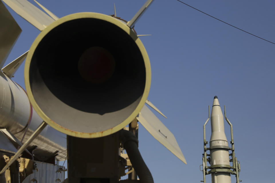 Qiam, right, Zolfgahr, second left, and Dezful missiles are displayed in a missile capabilities exhibition by the paramilitary Revolutionary Guard a day prior to second anniversary of Iran's missile strike on U.S. bases in Iraq in retaliation for the U.S. drone strike that killed top Iranian general Qassem Soleimani in Baghdad, at Imam Khomeini grand mosque, in Tehran, Iran, Friday, Jan. 7, 2022. Iran put three ballistic missiles on display on Friday, as talks in Vienna aimed at reviving Tehran's nuclear deal with world powers flounder. (AP Photo/Vahid Salemi)