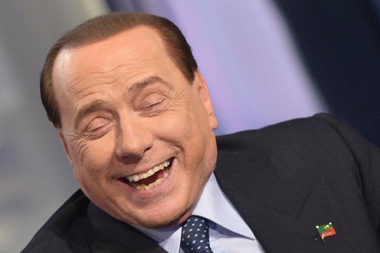 Former Italian premier Silvio Berlusconi, seen here during a TV show on May 22, 2014, has been acquitted of charges of having sex with an underage prostitute and abuse of power