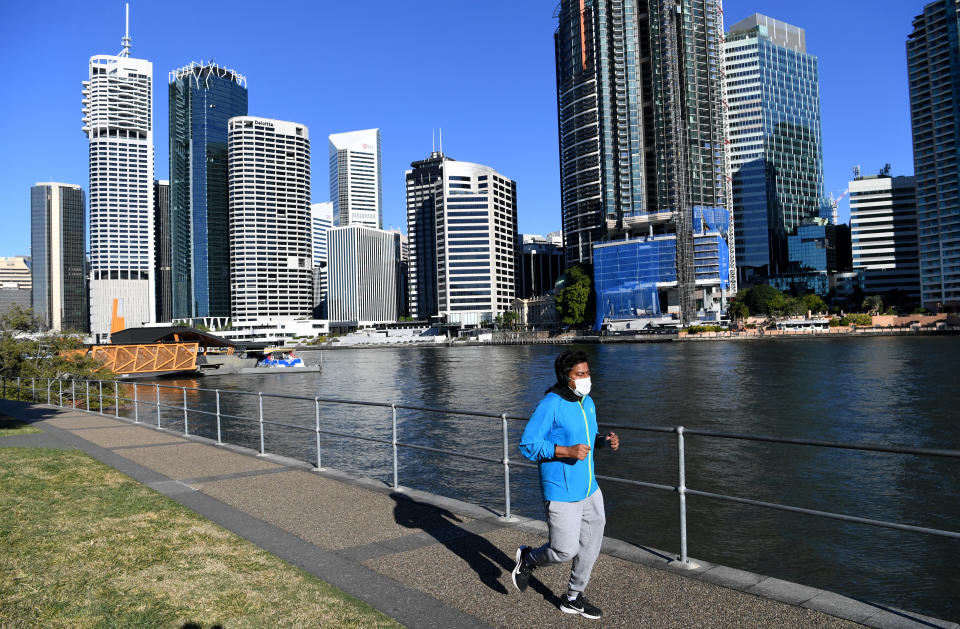 A man is seen exercising at Kangaroo Point in Brisbane on Thursday. Source: AAP