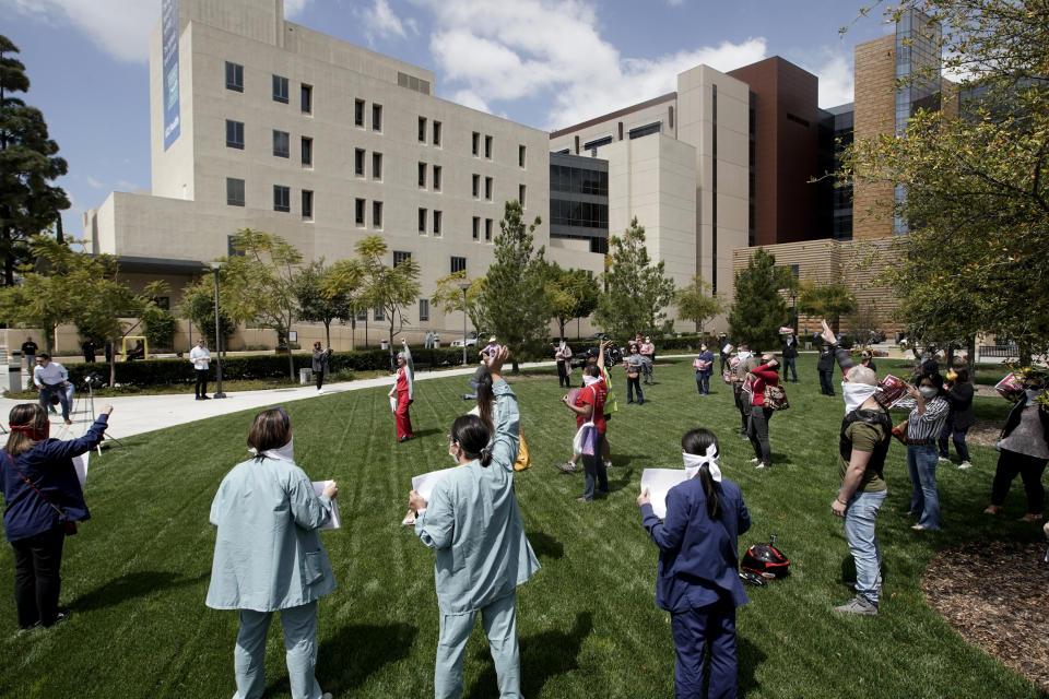 Image: Nurses at UCI Medical Center protest the lack of personal protective equipment available in Orange, Calif., on April 3, 2020. (Chris Carlson / AP file)