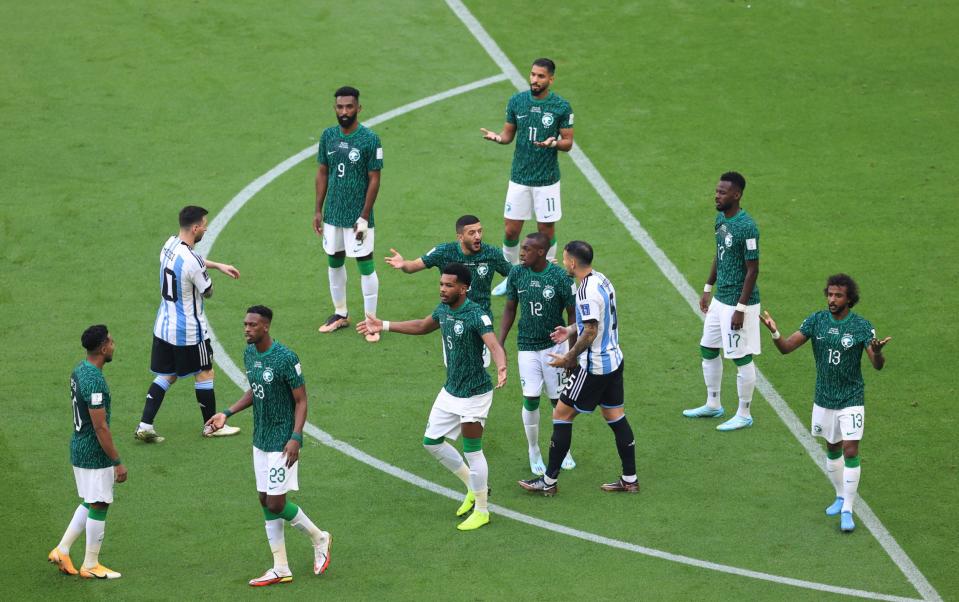 Saudi Arabia players complain and look confused as to why a penalty was awarded - GETTY IMAGES