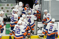 New York Islanders leave the ice after they were defeated in the overtime period of an NHL hockey game against the Boston Bruins, Monday, May 10, 2021, in Boston. The Bruins won 3-2 in overtime on a goal by Bruins left wing Taylor Hall. (AP Photo/Elise Amendola)