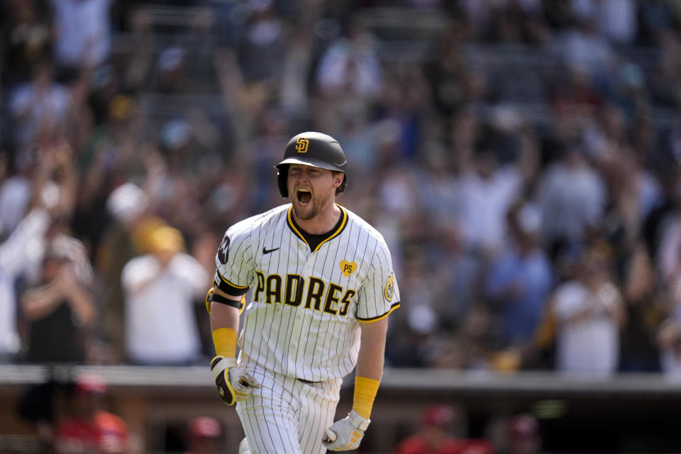 San Diego Padres' Jake Cronenworth celebrates after hitting a grand slam during the seventh inning of a baseball game against the Cincinnati Reds, Wednesday, May 1, 2024, in San Diego. (AP Photo/Gregory Bull)